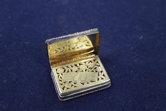 A William IV silver vinaigrette, with pierced gilt grille, engraved with a lyre, Edward Edwards II, London, 1834, 44mm.